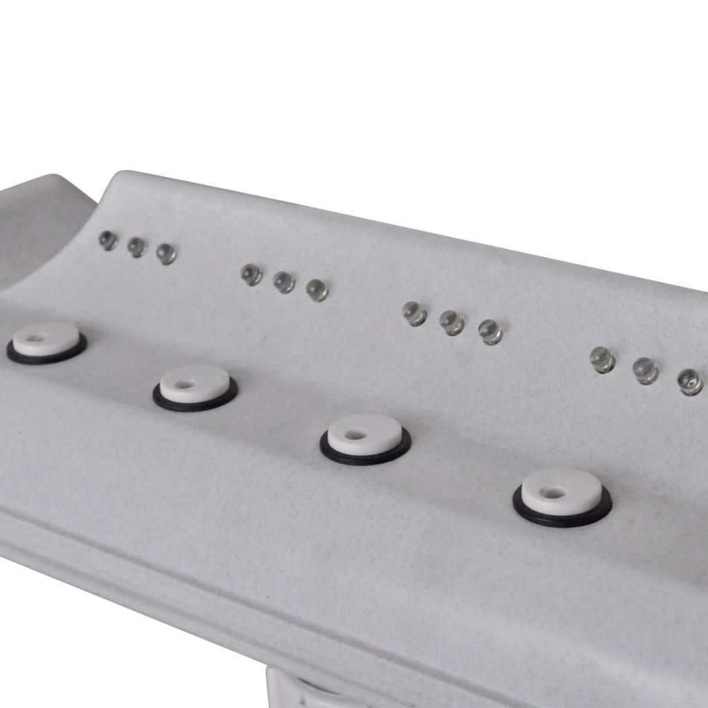White fountain control panel with four circular buttons and small indicator lights