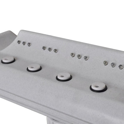 White fountain control panel with four circular buttons and small indicator lights