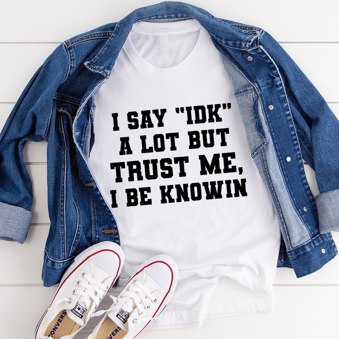 White crew-neck T-shirt with bold black statement graphic and stacked 'IDK' lettering.