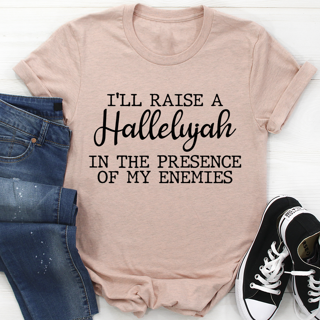 Heather peach T-shirt with centered "I'll Raise a Hallelujah" text graphic