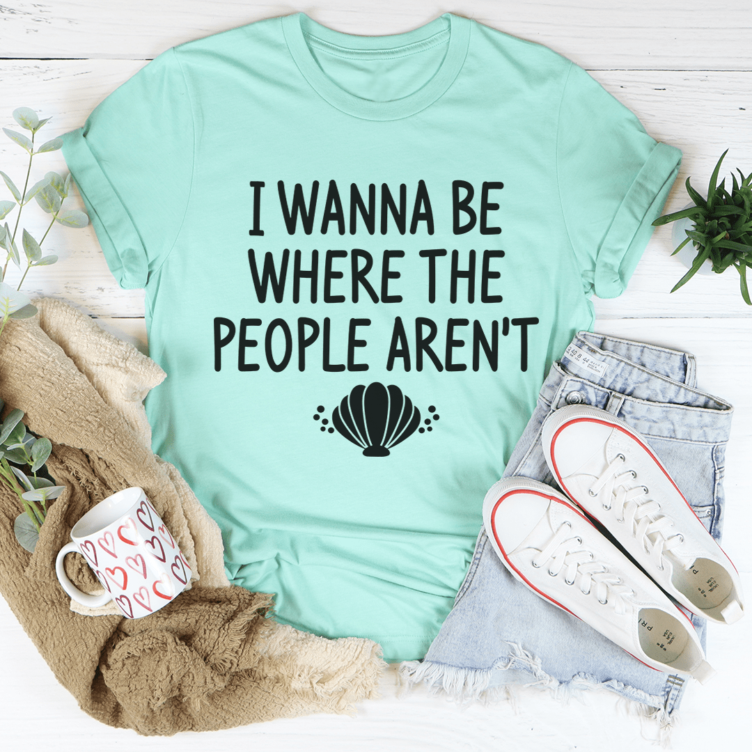 Mint green T-shirt with “I WANNA BE WHERE THE PEOPLE AREN’T” text and shell graphic
