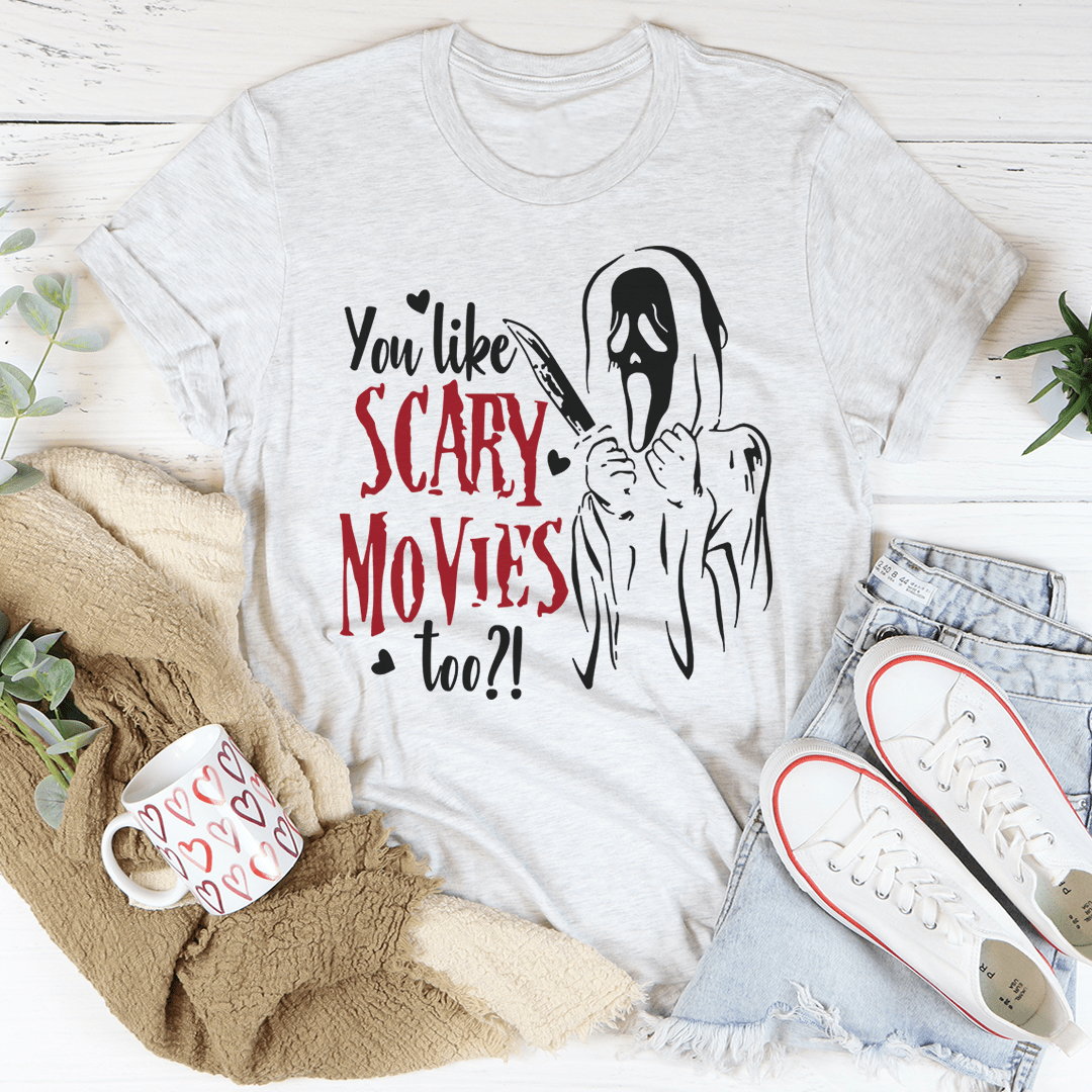 Light grey T-shirt with ghost face graphic and red 'SCARY MOVIES' lettering