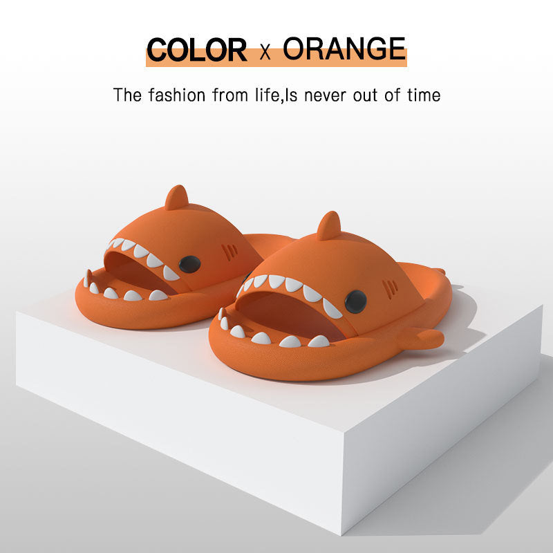 Orange shark-shape EVA slide sandals, open toe with ridged sole, pair view.