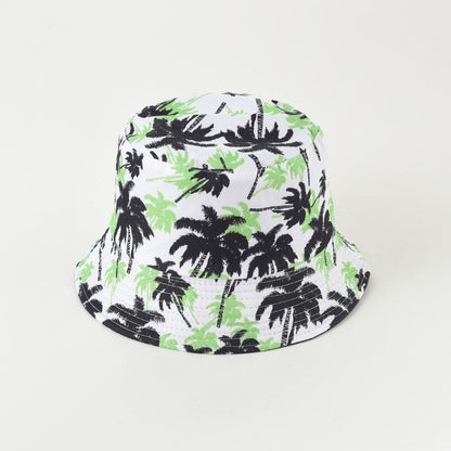 Palm leaf bucket hat with white base and black-green foliage print, wide brim