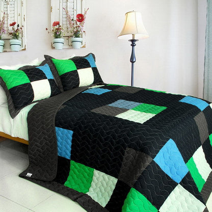 Black twin quilt set with green, white, and blue plaid patchwork and vermicelli quilting