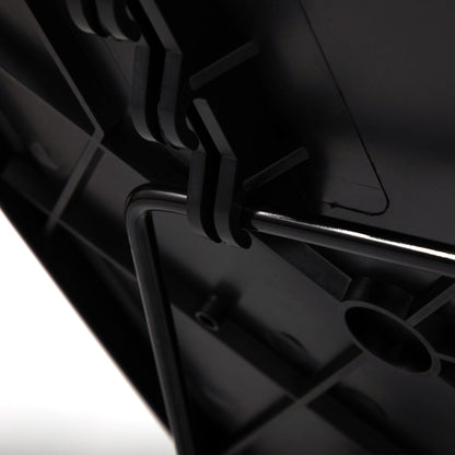 Close-up of black tray table hinge and adjustment mechanism