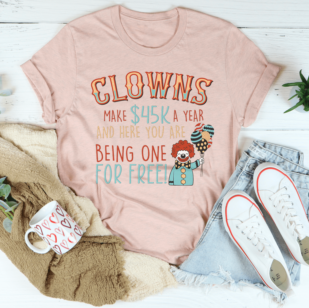 Peach T-shirt with colorful clown graphic and “Being one for free!” text