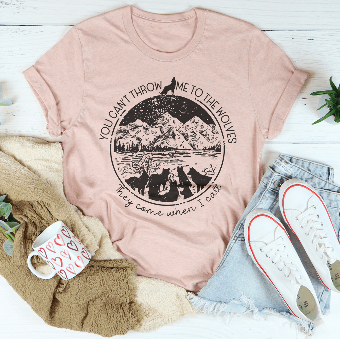 Mauve crewneck T-shirt, front displays circular mountain-and-wolves graphic