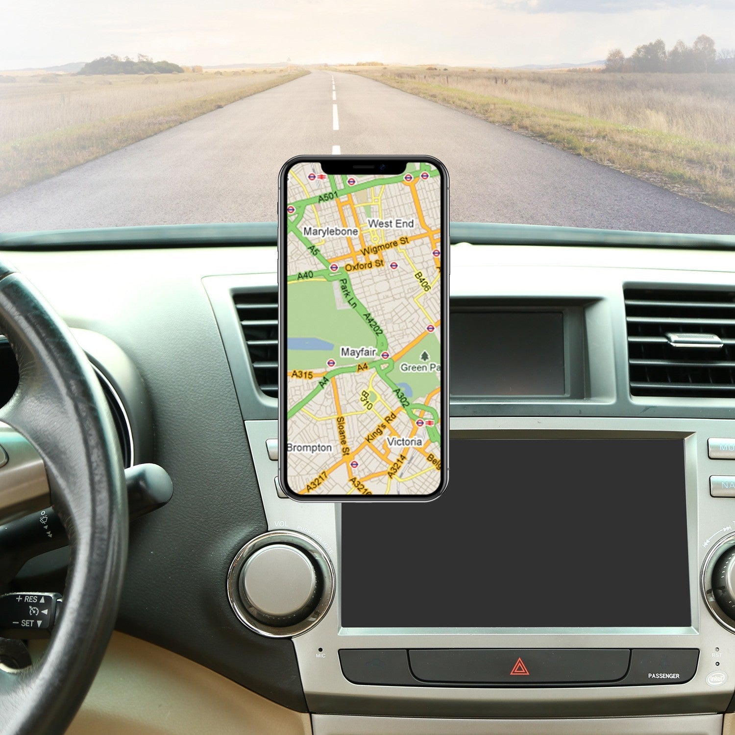 Black magnetic car phone mount holding a smartphone with charging ring