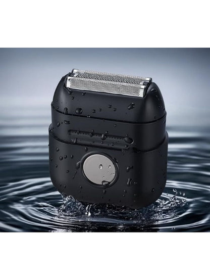 Men’s electric foil shaver with black body and water droplets