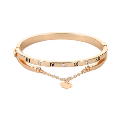 Gold stainless steel bracelet bangle with Roman numerals, small stones, heart pendant