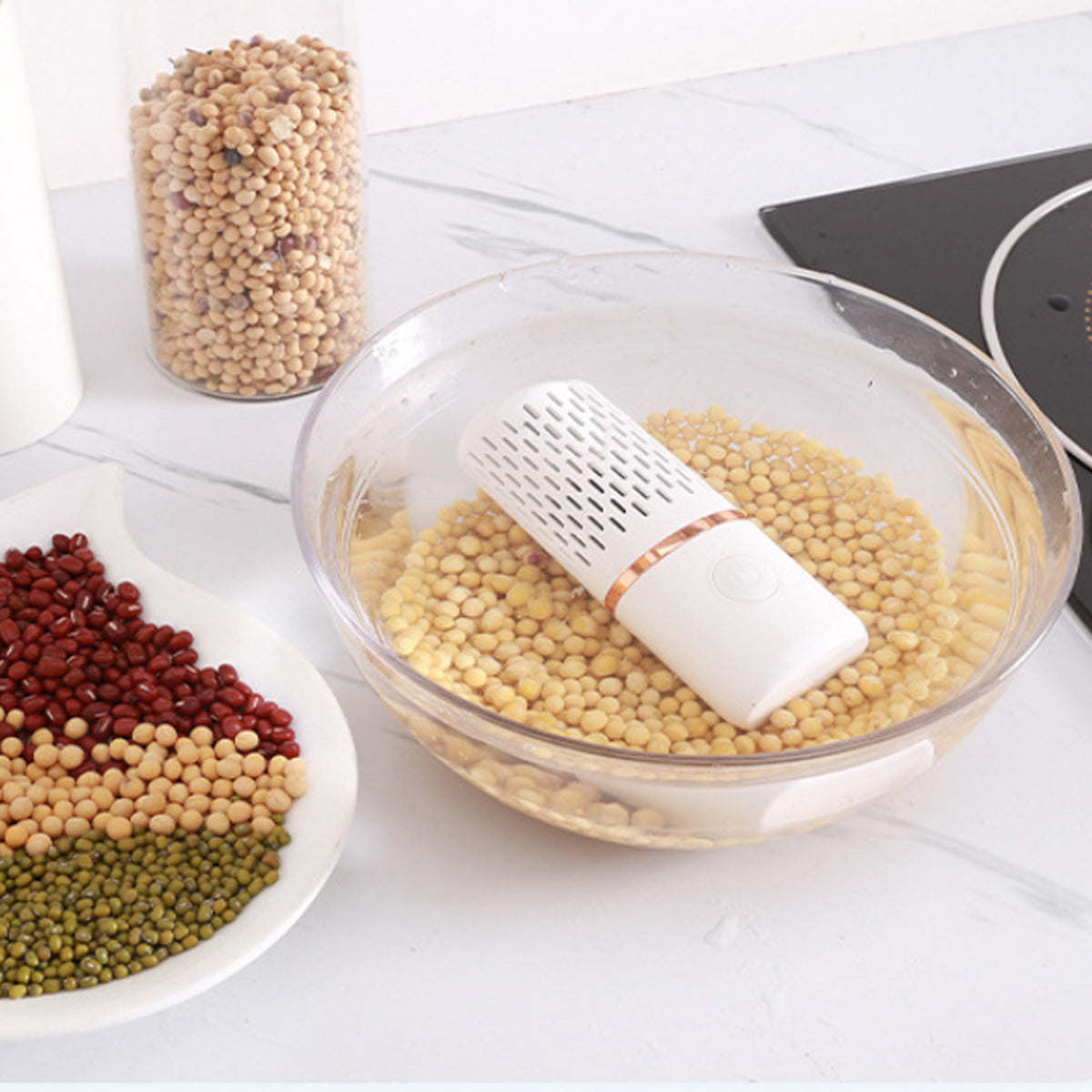 Ultrasonic produce cleaner resting on a bowl of yellow lentils