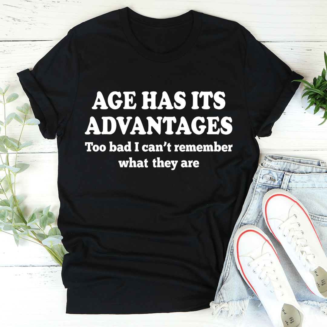 Black T-shirt with "AGE HAS ITS ADVANTAGES" slogan in white and black typography