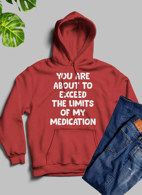 Red pullover hoodie with hood, front pocket, and 'exceed the limits' text