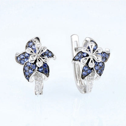 Blue and clear double-flower zircon stud earrings with silver-tone frame and stones