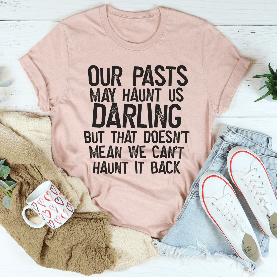 Light mauve T-shirt with black centered typographic slogan 'Our pasts...darling'
