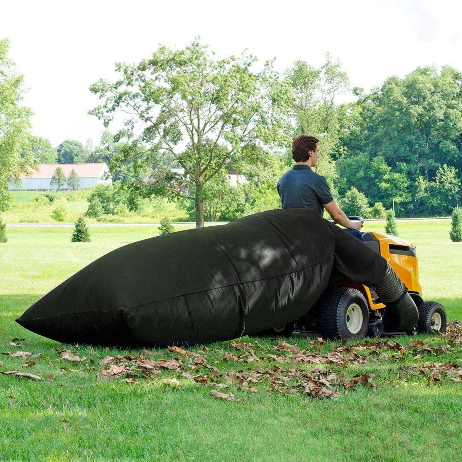 Black lawn mower leaf bag attached to rear discharge, cinched opening