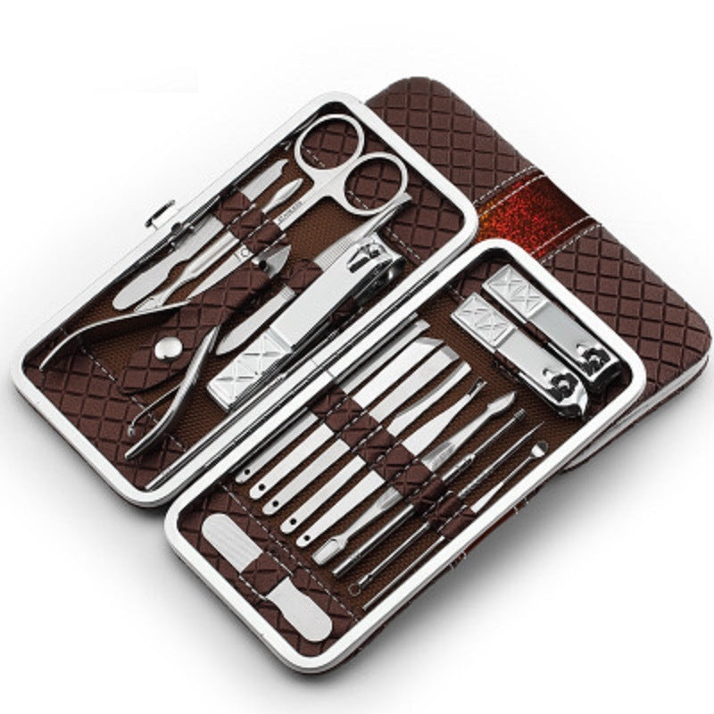 Nail clipper set travel grooming kit with brown hard case and stainless tools, open