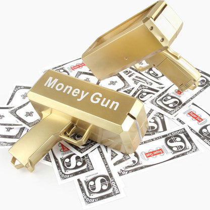 Gold plastic money gun prop with “Money Gun” label and pretend banknotes