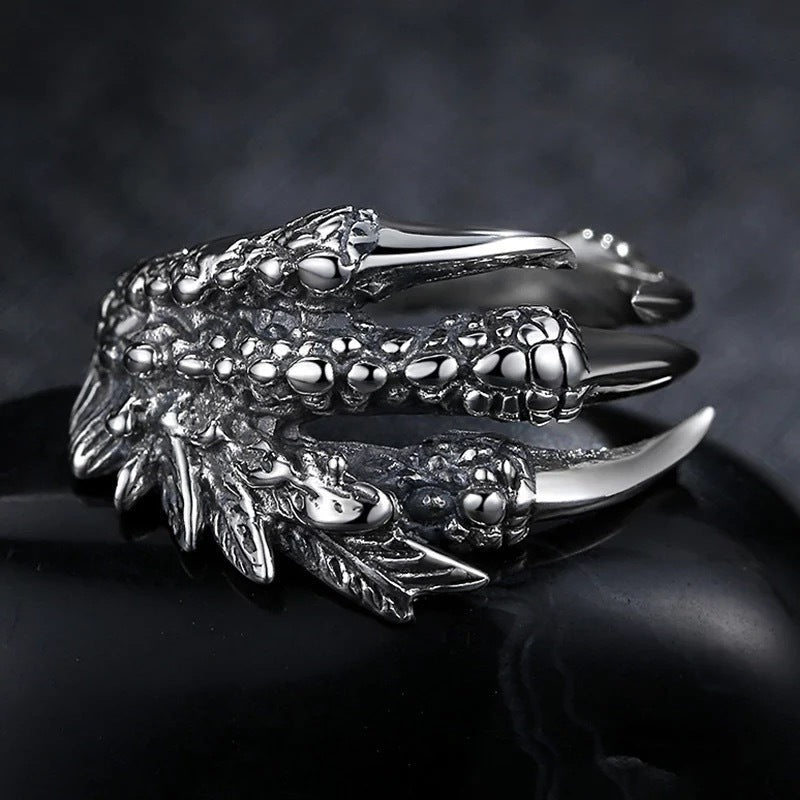 Silver open dragon claw ring with detailed scales and talons, wide adjustable band