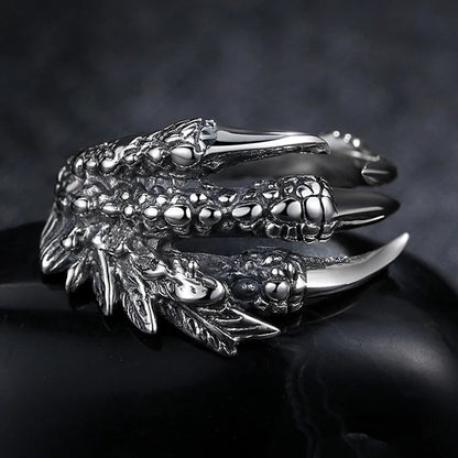 Silver open dragon claw ring with detailed scales and talons, wide adjustable band