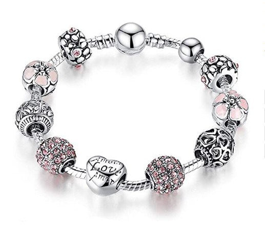 Silver-tone charm bracelet with pink sparkle beads and heart Love charm.