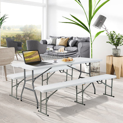 White folding camping table with gray metal frame and two folding bench seats