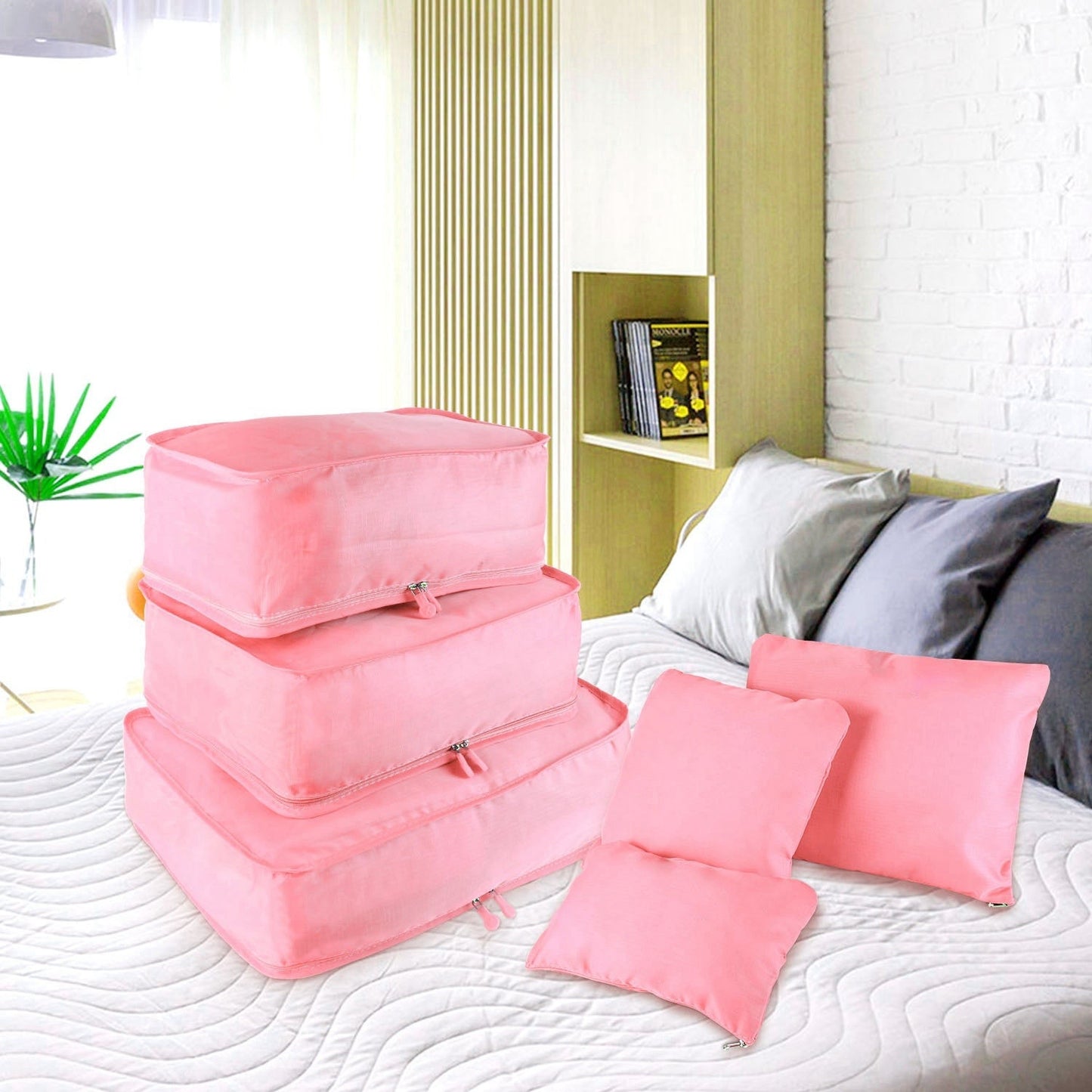 Pink water-resistant packing cube set with storage pillows and zip pouches