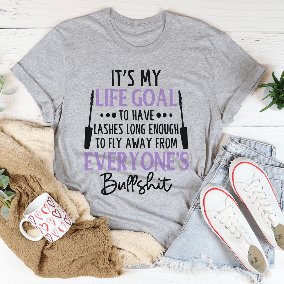 Gray crew-neck T-shirt with purple/black quote graphic, 'It's my life goal'