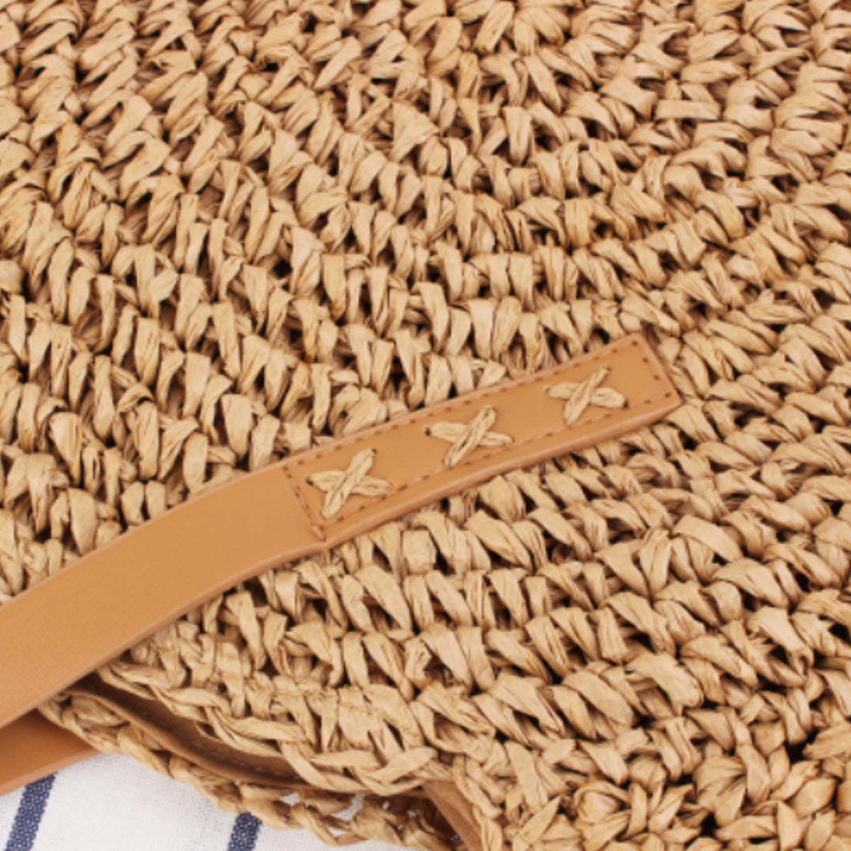 Straw tote bag strap with tan leather strip and three stitched star accents