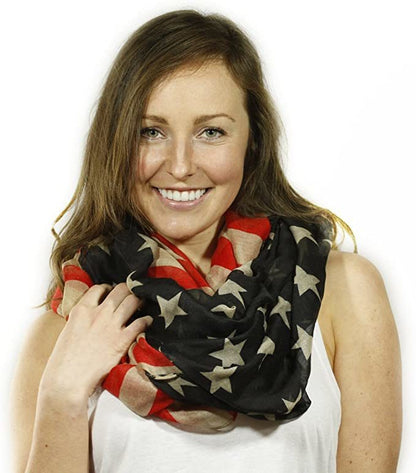 Infinity scarf in black, red, and cream with stars and striped pattern, looped around neck