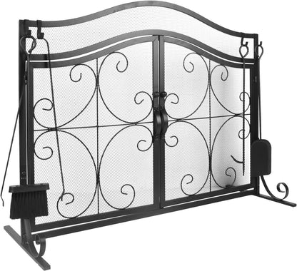 Black curved-top metal fireplace screen with two mesh doors and scroll pattern