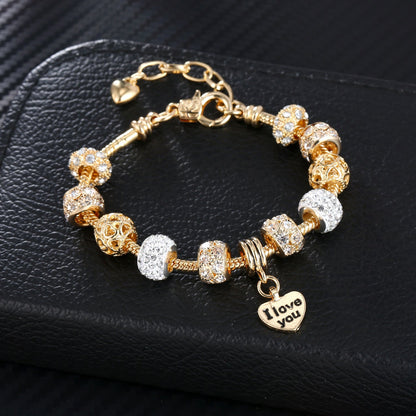 Gold plated heart charm bracelet with crystal bead charms and I love you heart pendant