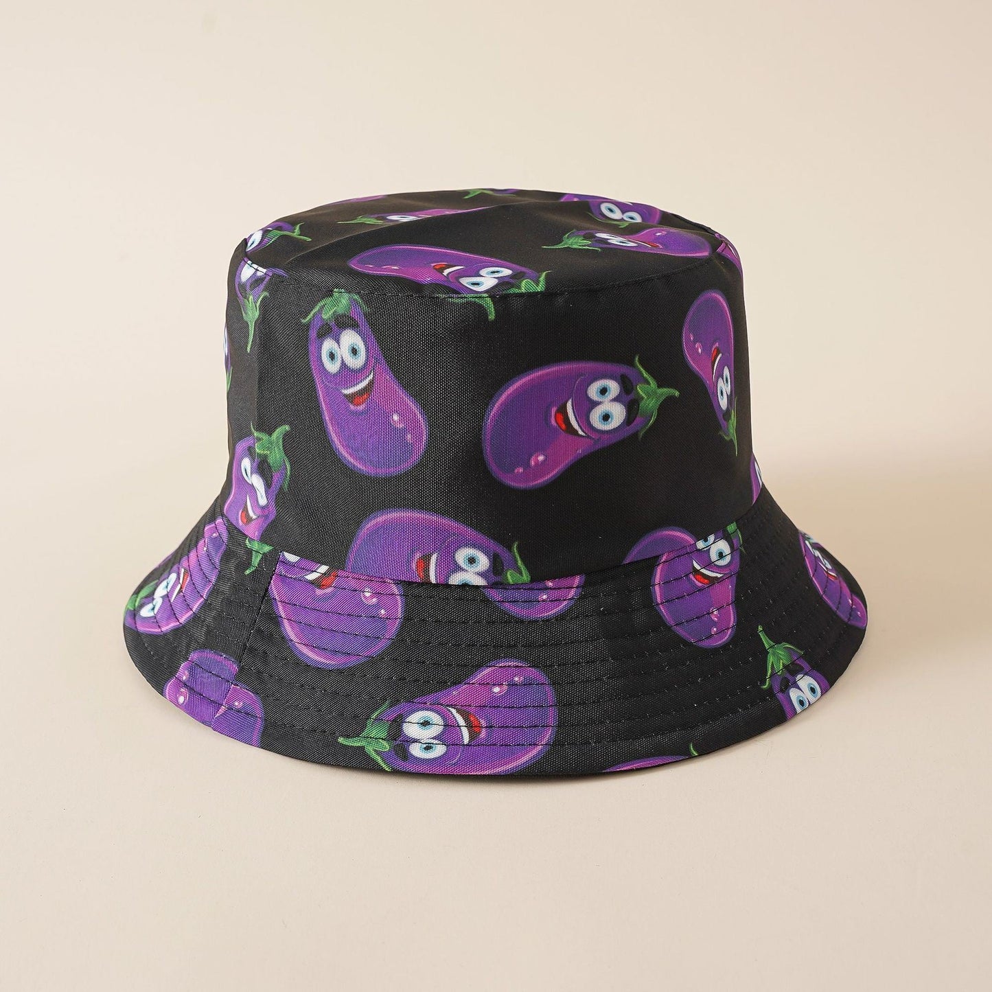 Fisherman hat in black with purple cartoon eggplant pattern, wide brim