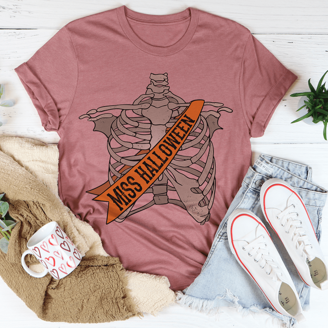 Mauve Halloween graphic tee with skeleton and bold orange 'Miss Halloween' sash.