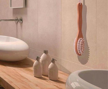 Wooden body massage brush with oval bristle head shown hanging