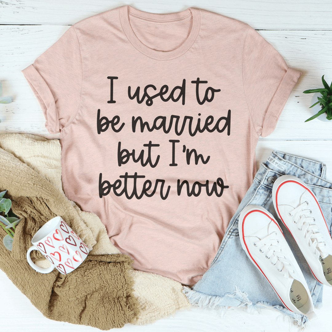 Blush pink T-shirt with black “I used to be married but I'm better now” lettering
