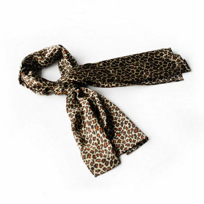Large silk scarf with subtle leopard print, dark and warm brown with cream accents