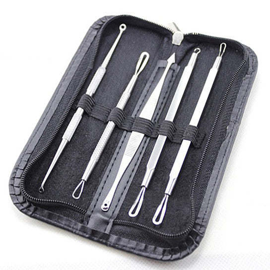 Gray zip pouch holding several silver facial tool tips