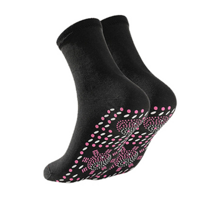 Pair of black self-heating health socks for women with pink dotted pattern on footbed