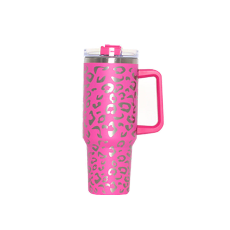 Pink leopard vacuum tumbler with handle, clear lid, and drinking straw