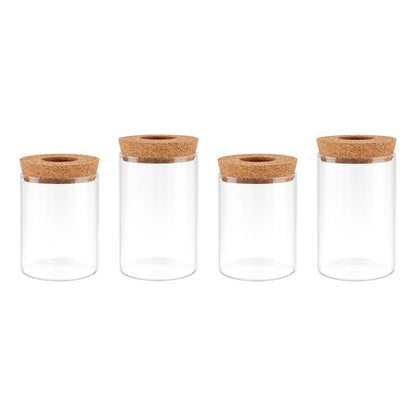 Four clear glass jars with cork lids for plant propagation, no plants
