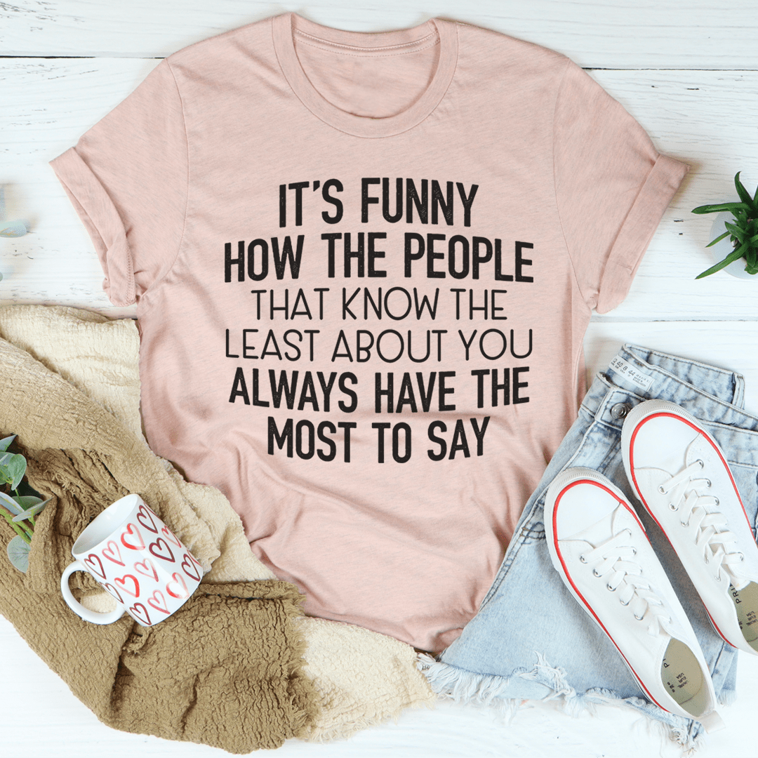Light pink T-shirt with bold quote graphic text: “IT’S FUNNY…”