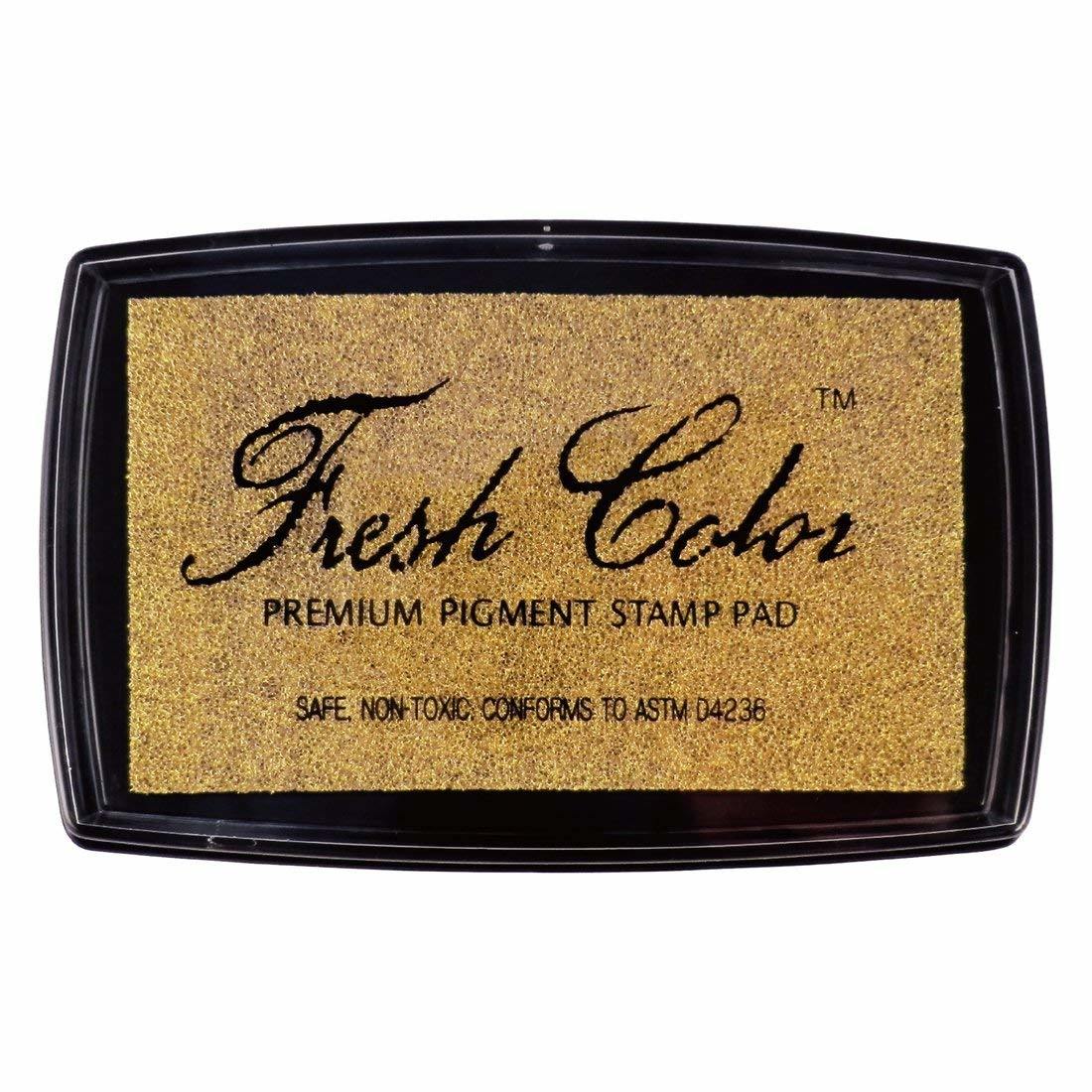 Gold pigment stamp pad in black case with 'Fresh Color' logo over speckled ink.