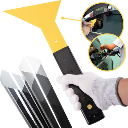 Yellow and black squeegee pressing window film, gloved grip on handle