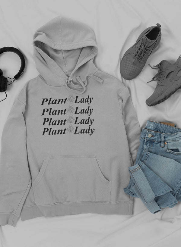Light-colored hoodie with drawstring hood and front pocket, "Plant Lady" text graphic