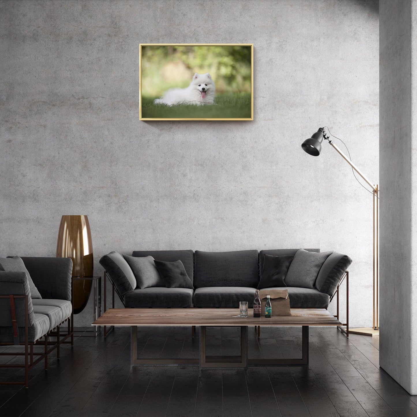Gold-framed pet photo canvas wall art above a dark sofa in a modern room