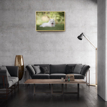 Gold-framed pet photo canvas wall art above a dark sofa in a modern room
