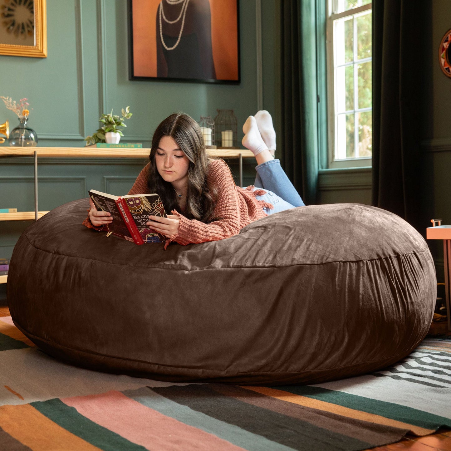 Dark brown cocoon bean bag chair with soft rounded cover for reading