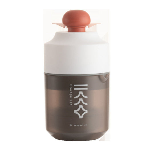 Portable manual citrus juicer with orange squeeze top and white-brown container